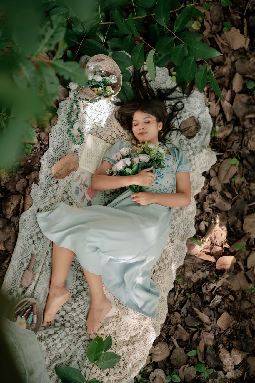 serene girl resting in forest with floral arrangement