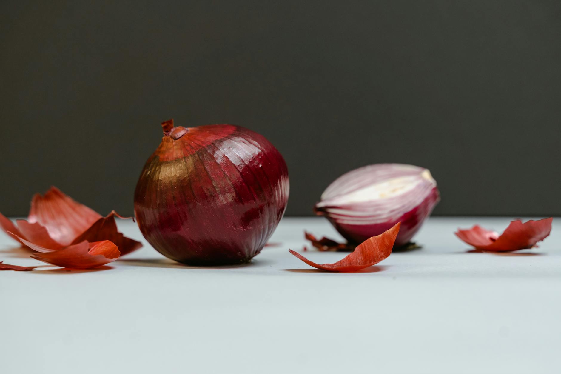 close up shot of onions on a white surface